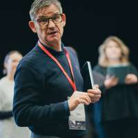 zdjęcie z warsztatów dla zespołów wokalnych przedstawiające ich uczestników