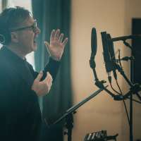 zdjęcie z warsztatów dla zespołów wokalnych przedstawiające ich uczestników